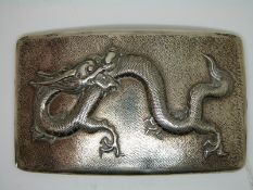 Chinese white metal curved cigarette case with dragon decoration in relief and hammered