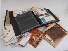 Four albums of all-world stamps, first day covers, presentation packs and sundry items