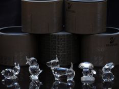Five Swarovski cut glass animals comprising two rabbits, dog, duckling and mushrooms