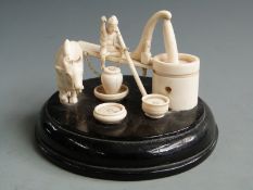 Chinese ivory scene of a man, oxen and well, H 10cm, diameter16cm