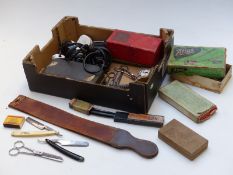 Collection of barber's shop related items including razors, strop, clippers, advertising ware etc