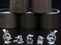 Five Swarovski cut glass animals comprising two squirrels, two mice and a rabbit