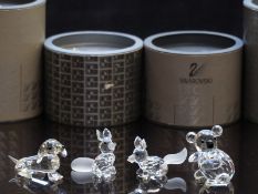Four Swarovski cut glass animals comprising two dogs, koala and a fox