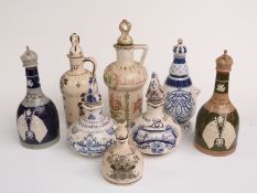Collection of porcelain and Delft decanters including Bols, Bing & Grondahl, Spode 1911