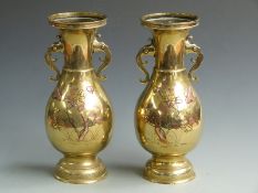 A pair of Japanese brass vases with twin elephant handles, H 34cm