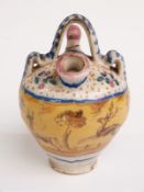 19thC continental Majolica style glazed olive oil pourer/ jar decorated with leaping deer, birds and