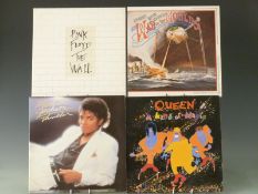 Approximately 50 albums including The Beatles, Pink Floyd, Status Quo, Abba etc