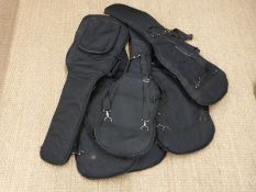 Six padded soft guitar carry cases.