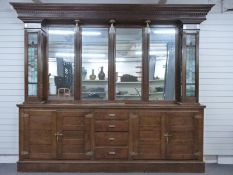 Early to mid 20th century American mirror back bar or shop fitting cabinet, the top having central