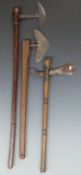 Three tribal axes including a 19thC African example. Maximum length 84cm
