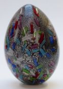 Murano 20thC glass egg decorated with murrine canes and silver leaf over a black ground, all cased