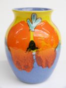 Poole Pottery bulbous vase decorated with a blue and orange pattern on a yellow ground, H24cm