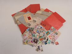 A large quantity of Russian stamps, mainly in packets, and a packet of loose all-world stamps