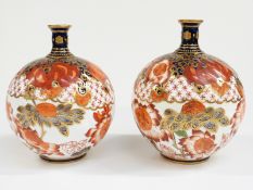 Crown Derby pair of wrythen moulded pedestal spherical vases decorated in Imari design, H13cm