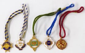 Five Edwardian and George V Sandown Park horse racing enamel badges, each with member's number to