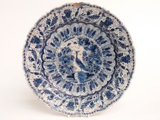 18th/19thC Delft charger / shallow dish decorated with birds, insects and flowers, signed to base