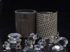 Eleven Swarovski cut glass animals including elephant, squirrel, swan, mouse, clam, bear etc, two in