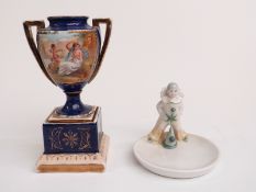 Vienna style lidded urn and a German figural pin dish, H17cm