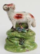 An 18th/19thC Staffordshire figure of a ram, H9cm