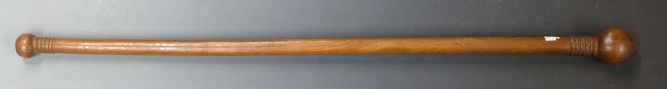 A 19thC African tribal double ended knobkerrie with carved ridged decoration, L75cm