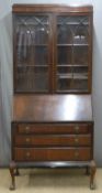 Mahogany bureau bookcase, the top with astragal glazed doors, the base with fitted fall flap and