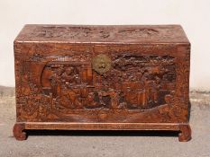 A carved Oriental camphorwood trunk, W104 x D50 x H64cm