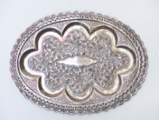 Burmese or similar white metal oval tray with pierced rim and embossed decoration, length 30.5cm,