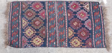 Handmade blue ground prayer mat or rug with geometric design, 100x47cm