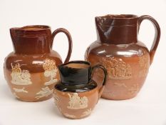 Three Doulton Lambeth salt glazed jugs including one impressed RN to base, tallest 18cm