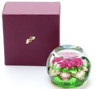 Perthshire faceted glass paperweight with central pink flower with green foliage and cane signed P