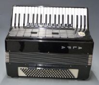 Alfa 120 bass piano accordion c1960's in black lacquered finish, 11 treble couplers and five brass