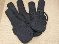 Five padded soft guitar carry cases.