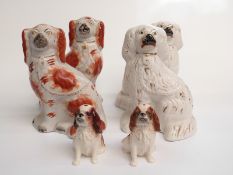 Two pairs of Staffordshire mantel dogs and a pair of Sylvac King Charles spaniels, tallest 27cm