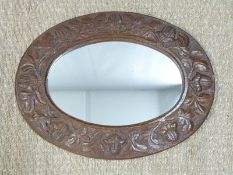 Carved oak framed mirror, similar country house letter box, folding fire screen and a pair of