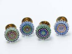 A set of four Perthshire millefiori faceted glass paperweight door knobs, each with a central cane