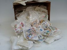 A very large quantity of loose Commonwealth and foreign stamps in packets