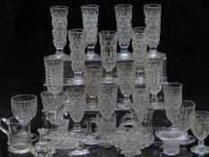 Twenty seven pressed glass vases, goblets and ornaments.