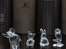 Four Swarovski cut glass animals comprising elephant, bear, owl and rabbit, all in original boxes