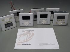 Crestron seven APAD wall mounted LCD controllers for Creston's Adagio home entertainment system,
