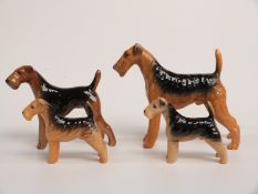 Three Beswick Airedale dogs including Cast Iron Monarch and one other, tallest 14cm