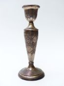 Iranian or similar Middle Eastern white metal candlestick with engraved decoration, unmarked, likley