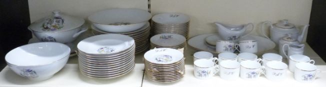 Limoges porcelain 12-place setting dinner and tea ware hand-decorated with birds and flowers and