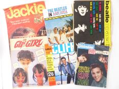 A collection of Beatles and sixties pop related items to include a bracelet and a 1960's copy of