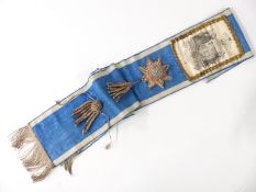 A 19thC Oddfellows sash with printed crest and silver thread tassels and roundels / stars