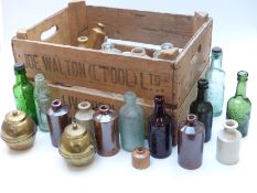A collection of glass and stoneware bottles to include Nibletts and R Whites etc together with