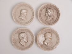 Four grand tour relief moulded plaques decorated with classical figures, diameter 5.8cm