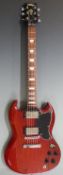 Electric lead / rhythm guitar by Vintage, in lacquered teak wood effect finish, with soft gig bag