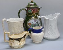 An ironstone jug, 19thC relief moulded jugs etc, height of tallest 24.5cm
