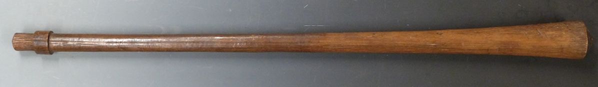 A 19thC Aboriginal war club of tapering form with carved ridged decoration along approximately