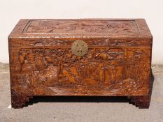 A carved Oriental camphorwood trunk, W101 x D53 x H56cm